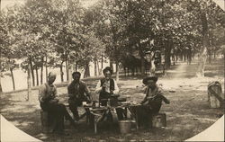 Men Eating in Park Men Eating in Park