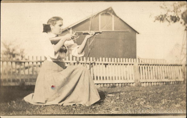Woman Aiming a Winchester Rifle Women