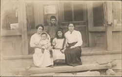 Women Sitting In Front of Shop with Children Postcard