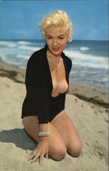 Beauty on the Beach - Young blonde kneeling in the sand Beauty on the Beach - Young blonde kneeling in the sand