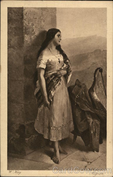 Pretty Lady With Long Black Hair Standing Near a Harp
