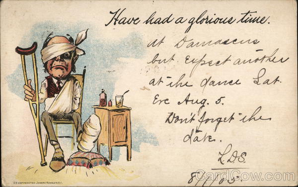 Man in Chair with a Crutch With Bandages on Head, Arm and Foot