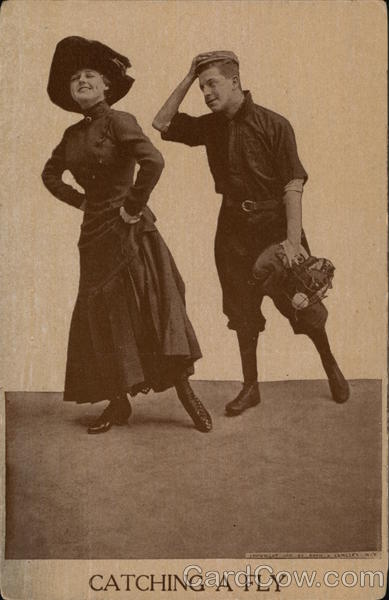 catching a fly - woman and baseball player posing