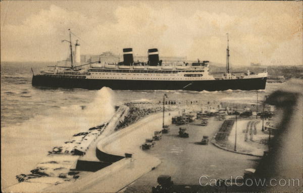 Large Ship In Harbor with Lighthouse in Background