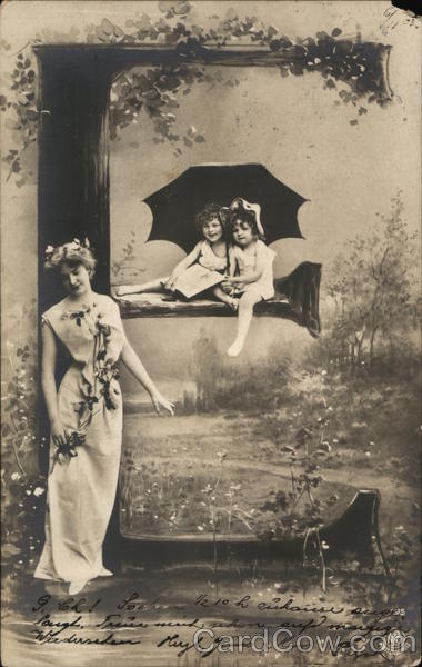 Woman standing by a large letter E, children with an umbrella on the center line