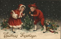 Christmas Greetings - children decorating a tree Christmas Greetings - children decorating a tree