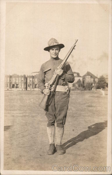 Soldier with Rifle Posing in Camp People in Uniform