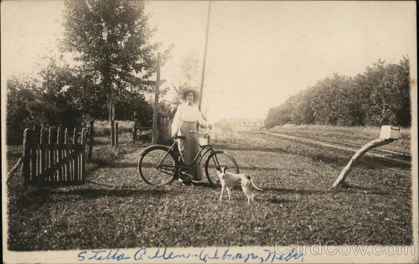 Woman Posing With a Bicycle and Dog Women