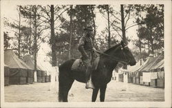 Soldier in Camp Posing on a Horse Postcard