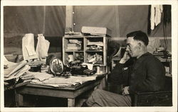 Man at a Desk Gazing at a Photograph Postcard