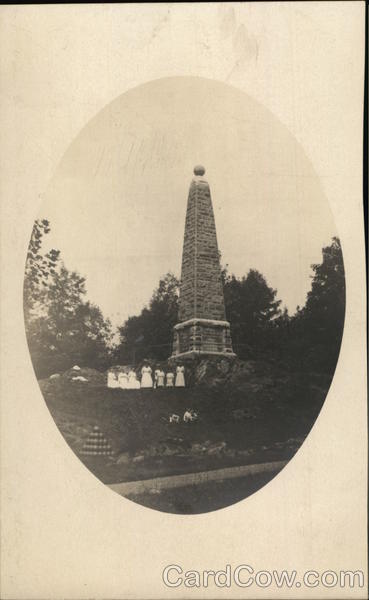 Girls Posing In Front of Stone Monument