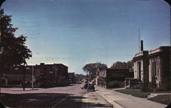 View of East Michigan Street Business Section Postcard