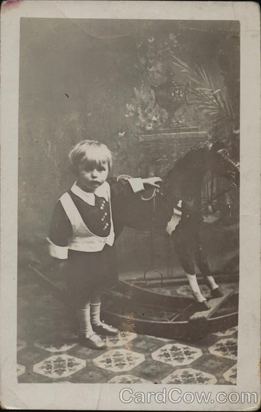Boy Posing With Rocking Horse Boys