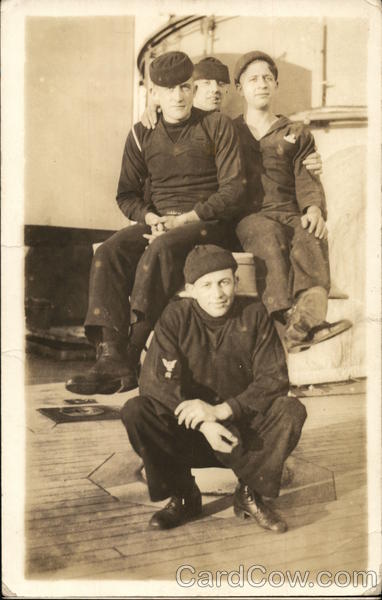 Four Sailors on Ship Navy