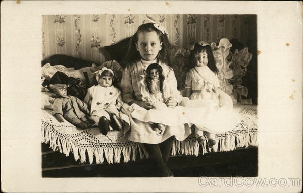 Girl Posing With Dolls