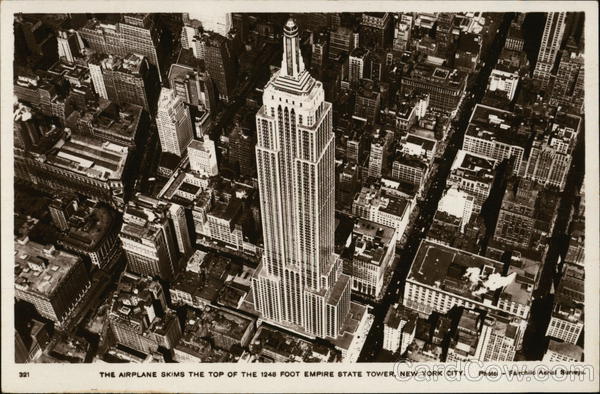 The Airplane Skims the Top of the Empire State Tower New York City