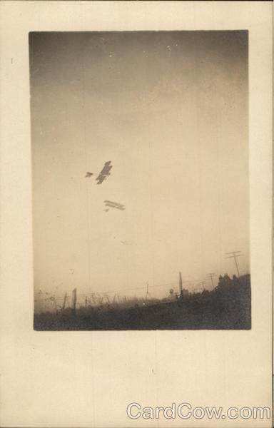 Two Early Biplanes in Sky Aircraft