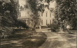 Curved Driveway Leading to House with Man and Woman Postcard