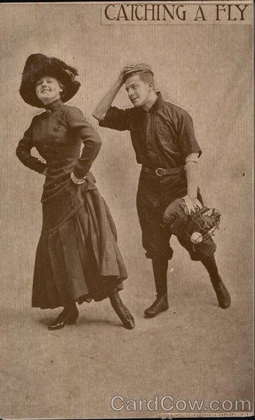 Baseball Player Standing Behind Smiling Woman