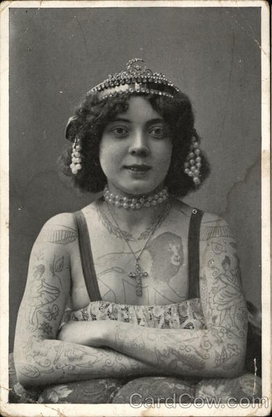 A Woman Wearing a Tiara Covered in Tattoos Women