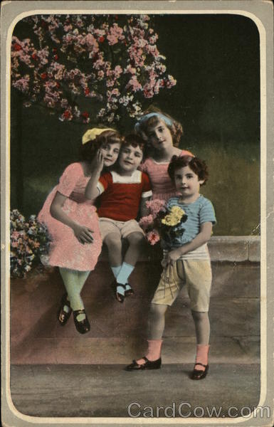 Four Children Near Flowering Bush
