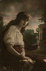 A Woman Sitting Outdoors Postcard