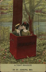 Couple in Box Marked "Rubbish" Kissing Couple in Box Marked "Rubbish" Kissing