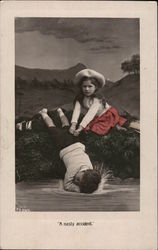 Little Girl With Hands on Fallen Little Boy Little Girl With Hands on Fallen Little Boy