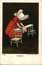 Little Girl in a red dress and white bonnet ironing Little Girl in a red dress and white bonnet ironing