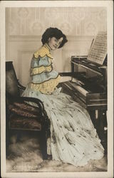 A Woman Sitting at a Piano Postcard