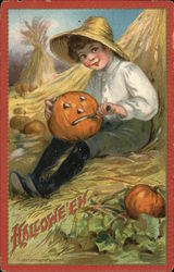 Boy Sitting on Hay Cutting Pumpkin Face Halloween Postcard Postcard Postcard