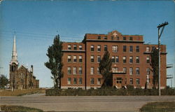 Church and Large Brick Building Postcard