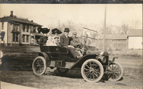 Family Wearing Hats in Open-Air Automobile Cars