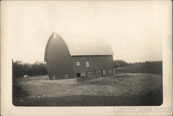 Large Newer Looking Barn Near Pasture and Trees Farming