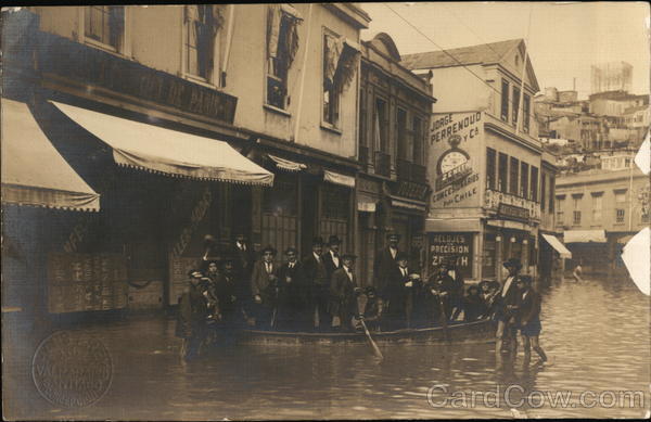 Group of People In Flooded Street with Boat Santiago Chile