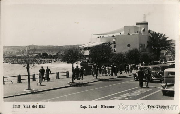 People Walking and Cars Parked Near Waterfront Chile