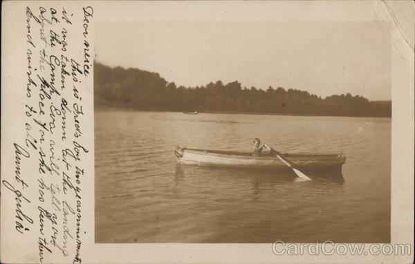 Young Boy in Rowboat on Lake Boys