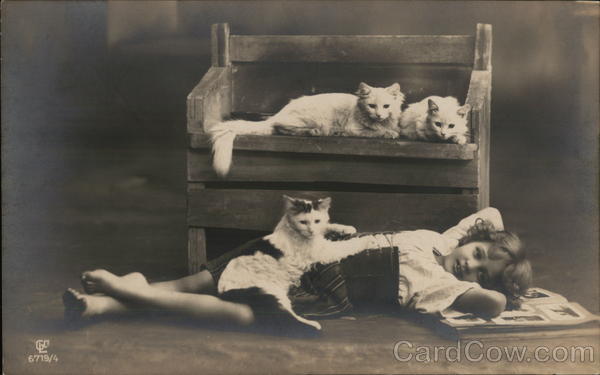 Young Girl Reclining on Floor with Three Cats