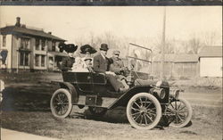Family Wearing Hats in Open-Air Automobile Postcard