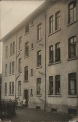 People at Windows in 3-Story Building, Children in Front Postcard