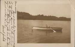 Young Boy in Rowboat on Lake Postcard