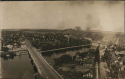 Aerial View of City with Bridge and Main Street Postcard