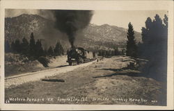 Steam Locomotive Pulling Cars Through Mountainous Region Postcard