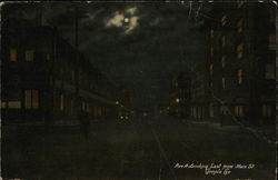 Avenue A looking East from Main Street at Night Postcard