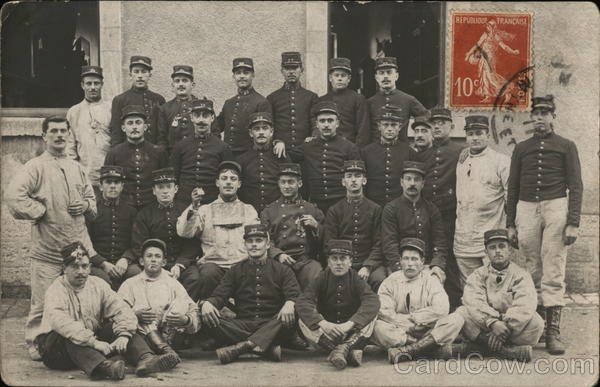 Uniformed Men Posing for Four-Tier Group Photo World War I