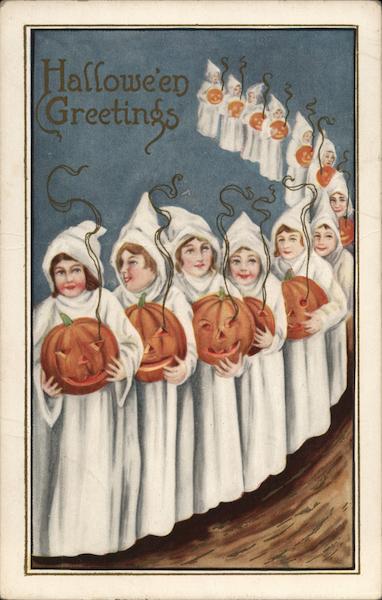 Line of White-Robed People Holding Jack-o-Lanterns