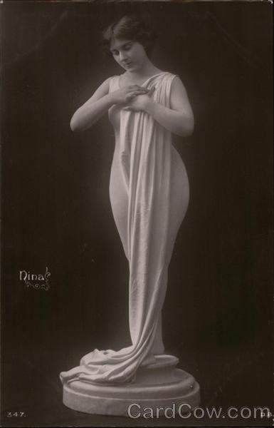 Nina: Woman on Pedestal with Flowing Fabric Draped to Floor
