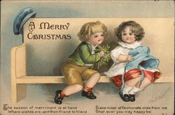 A Merry Christmas - Two Young Children Seated on Bench Postcard Postcard