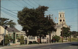 Main Street - Information Booth, Town Office Building and Methodist Church Postcard