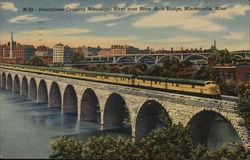 Streamliner Crossing Mississippi River Over Stone Arch Bridge, Minneapolis, Minn. Postcard